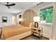 Well-lit bedroom showcasing a modern headboard, stylish side tables, and large windows at 129 Old Norton Rd, Fayetteville, GA 30215