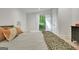 Charming bedroom with natural light, tranquil view, and hardwood floors at 129 Old Norton Rd, Fayetteville, GA 30215