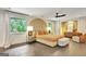 Spacious bedroom with hardwood floors, bright windows, and stylish decor at 129 Old Norton Rd, Fayetteville, GA 30215