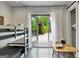Bedroom featuring bunk beds, a small table, and French doors that open to the outside at 129 Old Norton Rd, Fayetteville, GA 30215