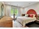 Bedroom featuring an upholstered headboard, French doors to the exterior, and patterned rug at 129 Old Norton Rd, Fayetteville, GA 30215