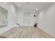Wood floored bonus room features ample light, stairs to another level, and a modern aesthetic at 129 Old Norton Rd, Fayetteville, GA 30215