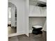 Well-organized closet with modern mirror and black stool at 129 Old Norton Rd, Fayetteville, GA 30215
