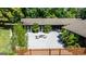 An inviting courtyard includes a fire pit and seating, surrounded by a privacy fence at 129 Old Norton Rd, Fayetteville, GA 30215