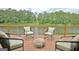 Outdoor deck with view of the lake, perfect for relaxing and entertaining at 129 Old Norton Rd, Fayetteville, GA 30215
