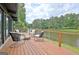 Relaxing deck area with peaceful lake view and comfortable seating at 129 Old Norton Rd, Fayetteville, GA 30215