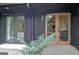Exterior detail showcasing double doors and adjacent windows, offering a view of the home interior at 129 Old Norton Rd, Fayetteville, GA 30215
