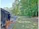 Exterior stone wall and lawn at 129 Old Norton Rd, Fayetteville, GA 30215