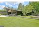 Stunning single-story home with lush green yard and unique architectural design at 129 Old Norton Rd, Fayetteville, GA 30215
