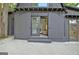 Barn-style home with sliding doors open to reveal a glimpse of the interior living space at 129 Old Norton Rd, Fayetteville, GA 30215