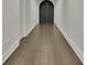 Long hallway with hardwood flooring, leading to other rooms in the home at 129 Old Norton Rd, Fayetteville, GA 30215