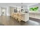 Modern kitchen with large island, stainless steel appliances, and bar stool seating at 129 Old Norton Rd, Fayetteville, GA 30215