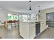Well-designed kitchen with an island, modern appliances, and a view into the dining area at 129 Old Norton Rd, Fayetteville, GA 30215