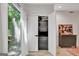 Modern laundry room with stacked washer/dryer, natural light, and ample storage at 129 Old Norton Rd, Fayetteville, GA 30215