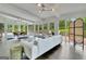 Bright living room with lake views, modern furnishings, and sleek hardwood flooring at 129 Old Norton Rd, Fayetteville, GA 30215
