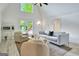 Living room featuring vaulted ceilings, modern furniture, wood-look floors, and natural light at 129 Old Norton Rd, Fayetteville, GA 30215