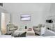 Inviting living room with plush armchairs, modern artwork, and an open layout for relaxation at 129 Old Norton Rd, Fayetteville, GA 30215