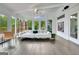 Spacious and bright living room with sleek floors, modern furnishings, and view of the outdoors at 129 Old Norton Rd, Fayetteville, GA 30215