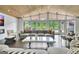 Stylish living room with hardwood floors, modern furniture, and a scenic lake view at 129 Old Norton Rd, Fayetteville, GA 30215