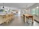 Open floor plan features an island with seating, dining area, and lake views at 129 Old Norton Rd, Fayetteville, GA 30215
