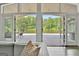 A lake view seen from the living room patio with open doors and serene scenery at 129 Old Norton Rd, Fayetteville, GA 30215