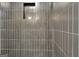 Shower features modern gray tiling with a built-in soap dish at 129 Old Norton Rd, Fayetteville, GA 30215