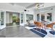 Open sunroom with a view of the kitchen, a dining set, and stylish interior at 129 Old Norton Rd, Fayetteville, GA 30215