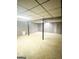 Large unfinished basement with support beams, panelling, and potential for storage or living space at 2574 Rosedale Dr, Morrow, GA 30260