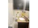 Bathroom featuring a granite sink vanity, toilet, and decorative mirror at 2574 Rosedale Dr, Morrow, GA 30260