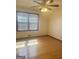 Bedroom with hardwood floors, ceiling fan, and large windows that bring in a lot of natural light at 2574 Rosedale Dr, Morrow, GA 30260