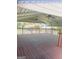Open-air deck with ceiling fans providing an outdoor entertaining area with neighborhood views at 2574 Rosedale Dr, Morrow, GA 30260