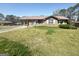 Charming single story brick home with carport and front yard featuring an easy to maintain lawn at 2574 Rosedale Dr, Morrow, GA 30260