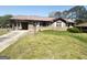 Charming single story brick home with carport and front yard featuring an easy to maintain lawn at 2574 Rosedale Dr, Morrow, GA 30260
