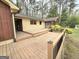 Multi-tiered back deck overlooking the back yard and mature landscaping at 2996 Jodeco Dr, Jonesboro, GA 30236