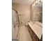 Neutral toned bathroom featuring a shower and vanity with a cream colored countertop at 2996 Jodeco Dr, Jonesboro, GA 30236