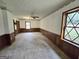 Bedroom featuring wainscoting, patterned wallpaper and a ceiling fan at 2996 Jodeco Dr, Jonesboro, GA 30236