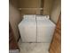 A closet featuring a stacked washer and dryer at 2996 Jodeco Dr, Jonesboro, GA 30236