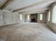 Bright and airy living room with stone fireplace and wood-paneled walls at 2996 Jodeco Dr, Jonesboro, GA 30236