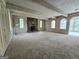 Spacious living room featuring a stone fireplace and light-colored wood panels at 2996 Jodeco Dr, Jonesboro, GA 30236