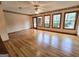 Bright living room with hardwood floors, large windows, and natural light at 2996 Jodeco Dr, Jonesboro, GA 30236