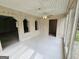 Bright sunroom with tiled flooring and multiple doorways leading to other rooms at 2996 Jodeco Dr, Jonesboro, GA 30236