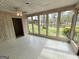 Light-filled sunroom with tiled floors and expansive lake views at 2996 Jodeco Dr, Jonesboro, GA 30236