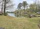 Lush green lawn leading up to the calm and peaceful waterfront at 2996 Jodeco Dr, Jonesboro, GA 30236