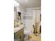 Charming bathroom with white and grey tile, decorative shower curtain and accent art at 710 Bluebird Se Dr, Conyers, GA 30094