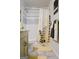 Bathroom featuring neutral tile, stylish shower curtain, and a decorative yellow rug at 710 Bluebird Se Dr, Conyers, GA 30094