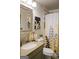 Bathroom featuring a vanity with granite countertop, decorative shower curtain and neutral accents at 710 Bluebird Se Dr, Conyers, GA 30094