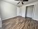 Bedroom featuring wood-look flooring, closet, and neutral walls at 710 Bluebird Se Dr, Conyers, GA 30094