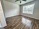 Bright bedroom features wood flooring, neutral paint, and a ceiling fan at 710 Bluebird Se Dr, Conyers, GA 30094