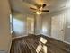 Bedroom with wood floors, neutral paint, and two entryways at 710 Bluebird Se Dr, Conyers, GA 30094