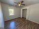 Bedroom with closet, ceiling fan and hardwood floors at 710 Bluebird Se Dr, Conyers, GA 30094